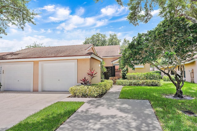 8368 Sunmeadow Ln, Boca Raton, FL 33496 - view of front facade featuring stucco siding, a shingled roof, a front lawn, driveway, and an attached garage