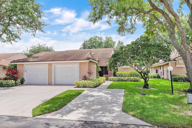 8368 Sunmeadow Ln, Boca Raton, FL 33496 - view of front of home featuring stucco siding, a front yard, an attached garage, driveway, and a shingled roof