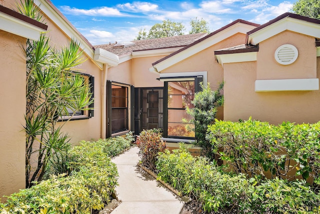 8368 Sunmeadow Ln, Boca Raton, FL 33496 - doorway to property with stucco siding