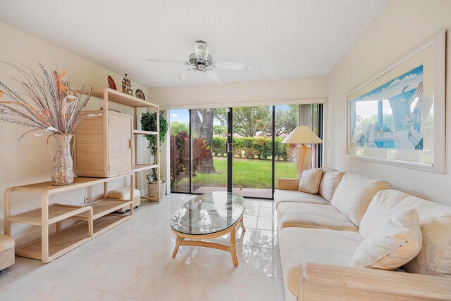 8368 Sunmeadow Ln, Boca Raton, FL 33496 - living area featuring healthy amount of natural light, light tile patterned flooring, and a ceiling fan