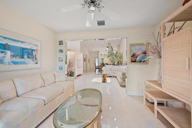 8368 Sunmeadow Ln, Boca Raton, FL 33496 - living area with a ceiling fan, a textured ceiling, and light tile patterned flooring