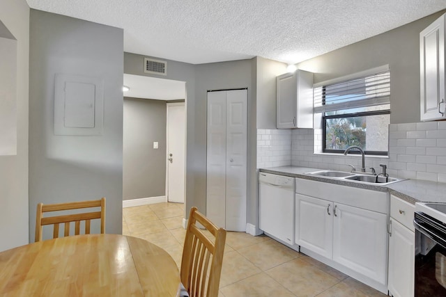 6855 W Broward Blvd Unit 406, Plantation, FL 33317 - kitchen with dishwasher, light tile patterned floors, decorative backsplash, white cabinets, and a textured ceiling