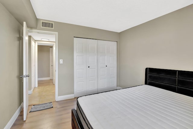 6855 W Broward Blvd Unit 406, Plantation, FL 33317 - bedroom with light wood-type flooring and a closet
