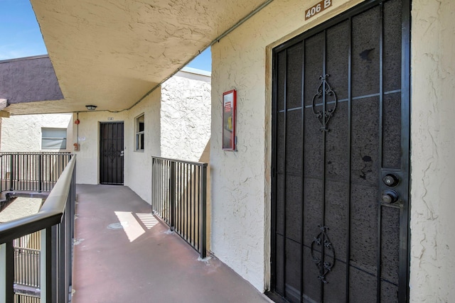 6855 W Broward Blvd Unit 406, Plantation, FL 33317 - doorway to property featuring a balcony and stucco siding