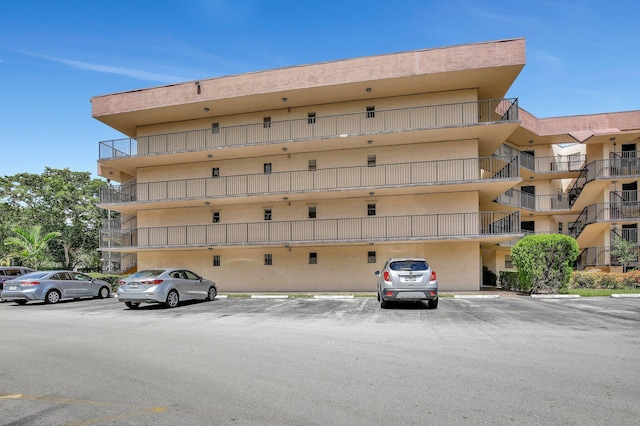 6855 W Broward Blvd Unit 406, Plantation, FL 33317 - view of apartment building / complex featuring covered parking