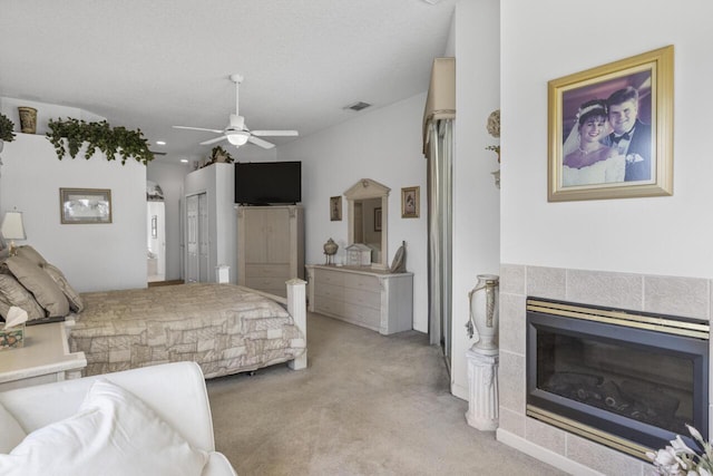 1267 SW Briarwood Dr, Saint Lucie West, FL 34986 - bedroom with light carpet, a fireplace, a ceiling fan, and recessed lighting