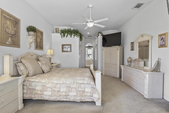 1267 SW Briarwood Dr, Saint Lucie West, FL 34986 - bedroom with light carpet, a textured ceiling, and a ceiling fan