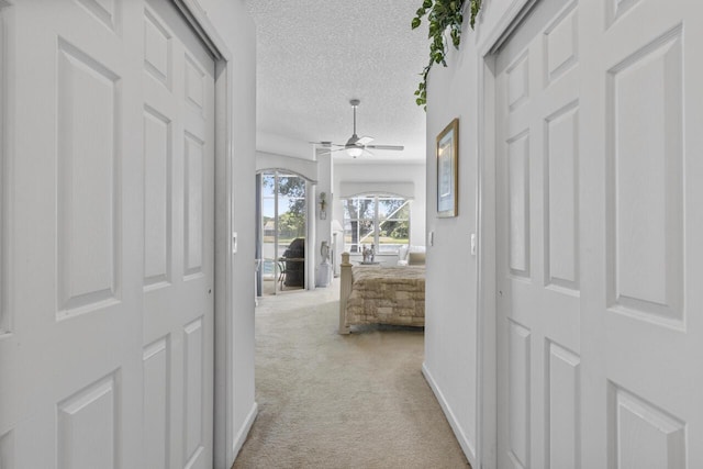 1267 SW Briarwood Dr, Saint Lucie West, FL 34986 - corridor with light carpet and a textured ceiling