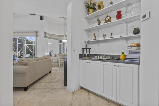 1267 SW Briarwood Dr, Saint Lucie West, FL 34986 - indoor bar with a textured ceiling