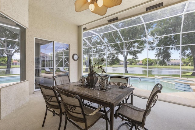 1267 SW Briarwood Dr, Saint Lucie West, FL 34986 - sunroom / solarium with a jacuzzi, a ceiling fan, a water view, and plenty of natural light