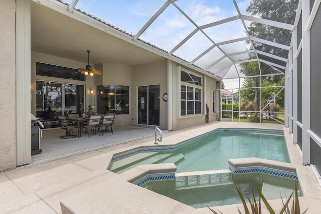 1267 SW Briarwood Dr, Saint Lucie West, FL 34986 - view of swimming pool featuring a pool with connected hot tub, a patio, a ceiling fan, and outdoor dining area