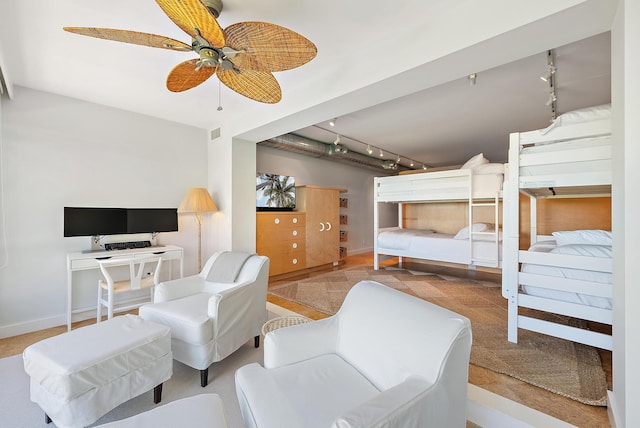 2 Church Ln Unit 115, North Palm Beach, FL 33408 - bedroom with rail lighting and baseboards