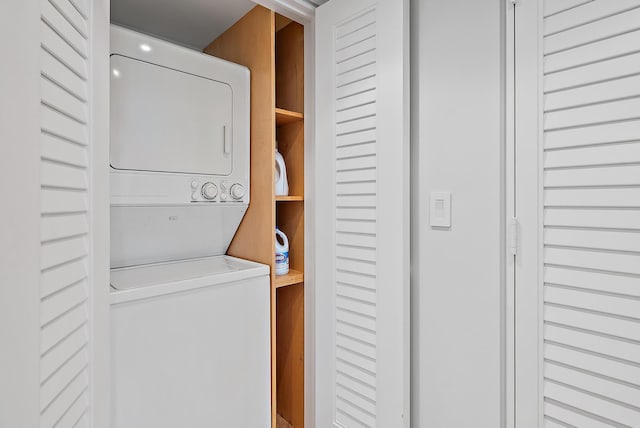 2 Church Ln Unit 115, North Palm Beach, FL 33408 - washroom with stacked washing machine and dryer