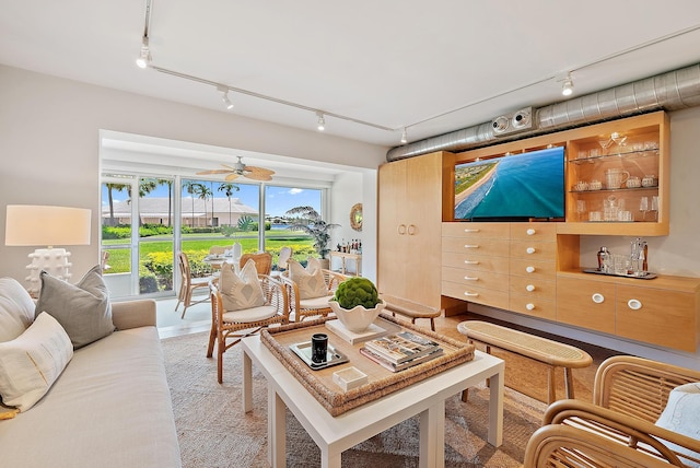 2 Church Ln Unit 115, North Palm Beach, FL 33408 - living room featuring rail lighting and a ceiling fan