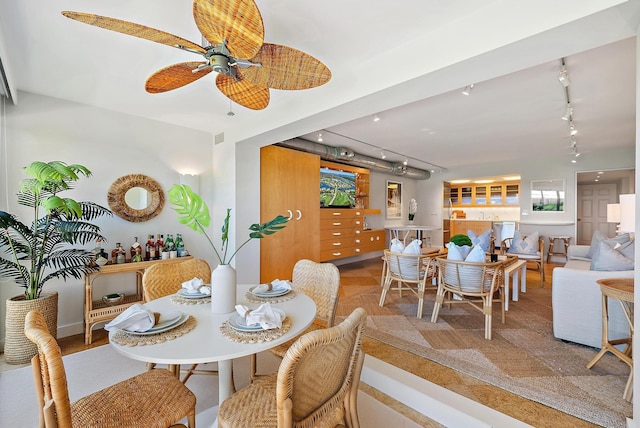 2 Church Ln Unit 115, North Palm Beach, FL 33408 - dining area featuring rail lighting and ceiling fan