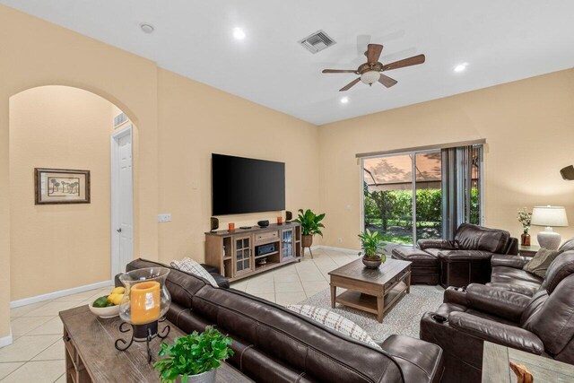 4086 Woodhill Pl, Boynton Beach, FL 33436 - living area featuring light tile patterned floors, arched walkways, a ceiling fan, and recessed lighting