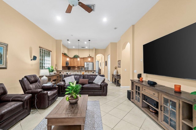 4086 Woodhill Pl, Boynton Beach, FL 33436 - living room featuring arched walkways, a ceiling fan, and light tile patterned floors