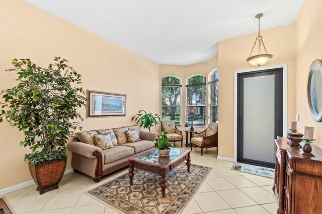 4086 Woodhill Pl, Boynton Beach, FL 33436 - living room featuring light tile patterned floors and baseboards