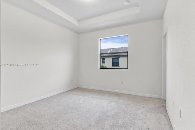 10606 W 33rd Ct, Hialeah, FL 33018 - empty room with a tray ceiling, carpet flooring, and a smoke detector