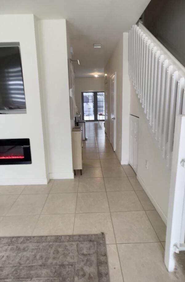 10606 W 33rd Ct, Hialeah, FL 33018 - hall with light tile patterned floors