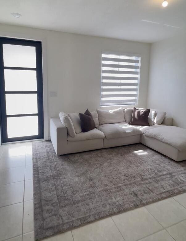 10606 W 33rd Ct, Hialeah, FL 33018 - living area with tile patterned floors