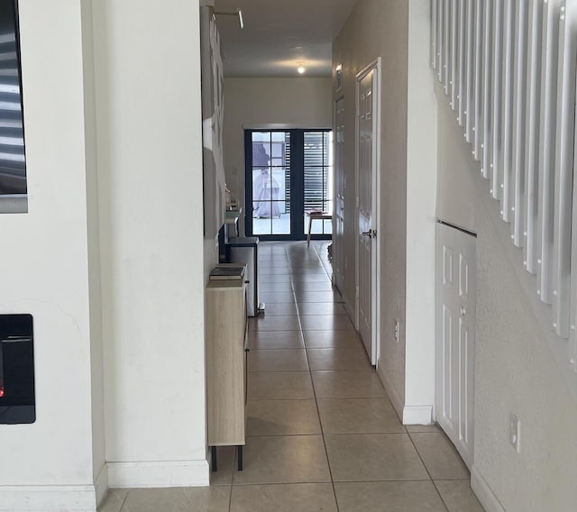 10606 W 33rd Ct, Hialeah, FL 33018 - hallway featuring light tile patterned flooring and stairway