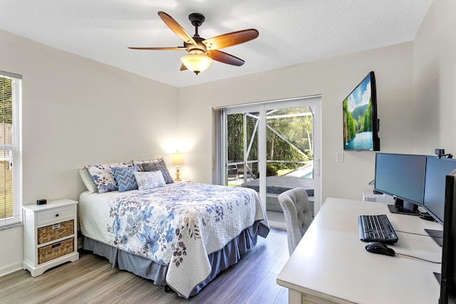 207 Jupiter Woods Dr, Jupiter, FL 33458 - bedroom featuring access to outside, light wood-style floors, and a ceiling fan