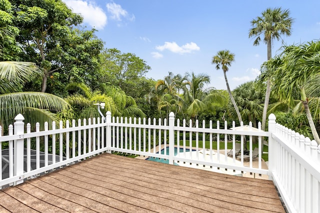 207 Jupiter Woods Dr, Jupiter, FL 33458 - wooden deck featuring view of scattered trees