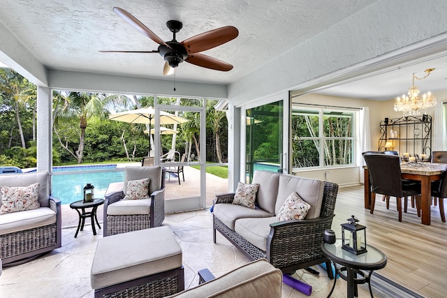 207 Jupiter Woods Dr, Jupiter, FL 33458 - sunroom with a chandelier and healthy amount of natural light