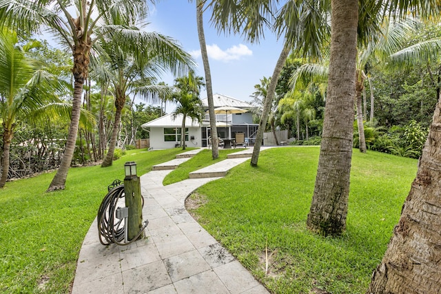 207 Jupiter Woods Dr, Jupiter, FL 33458 - view of grassy yard featuring a patio