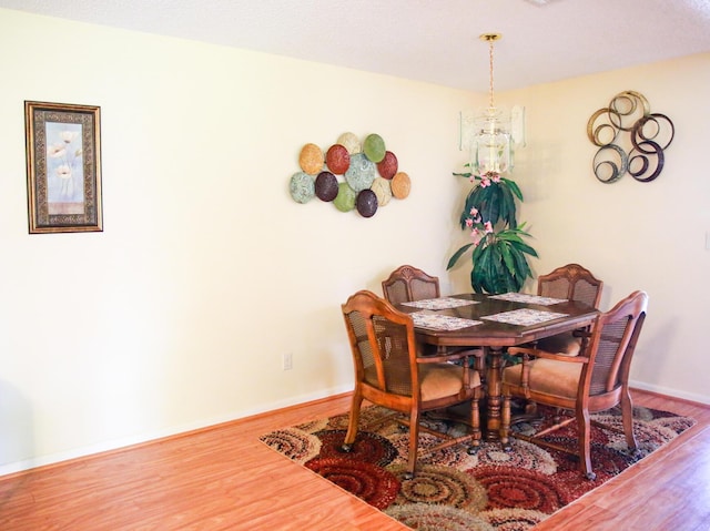 1023 Pheasant Run Dr Unit A, Fort Pierce, FL 34982 - dining room with wood finished floors and baseboards