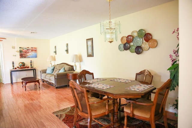 1023 Pheasant Run Dr Unit A, Fort Pierce, FL 34982 - dining space with light wood-type flooring and a chandelier