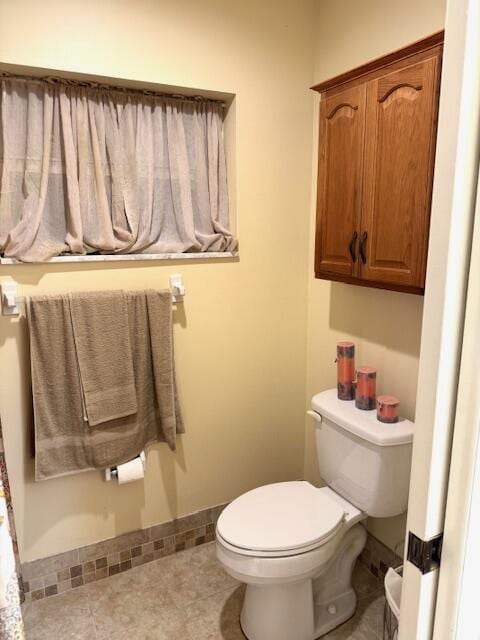 1023 Pheasant Run Dr Unit A, Fort Pierce, FL 34982 - bathroom featuring toilet and baseboards