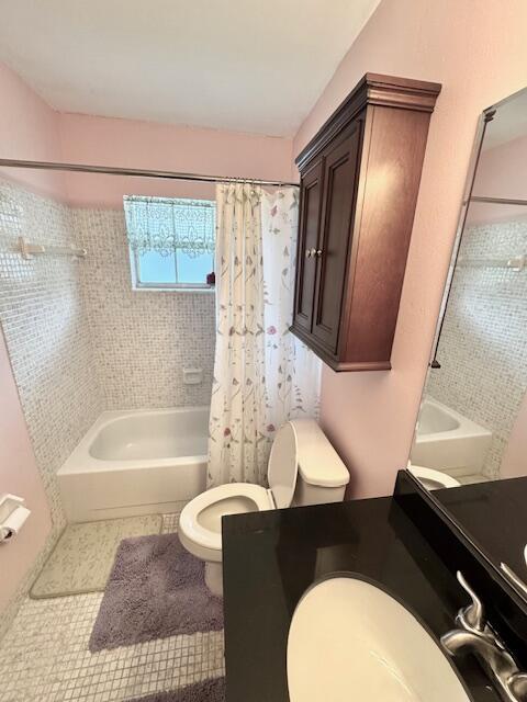 1023 Pheasant Run Dr Unit A, Fort Pierce, FL 34982 - full bath featuring shower / bath combo, vanity, and tile patterned floors