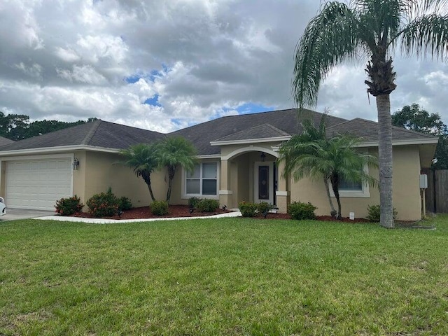 3718 SW Masilunas St, Port Saint Lucie, FL 34953 - ranch-style house featuring stucco siding, a front lawn, an attached garage, and a shingled roof