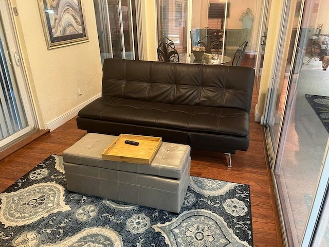 3718 SW Masilunas St, Port Saint Lucie, FL 34953 - living room featuring wood finished floors and baseboards