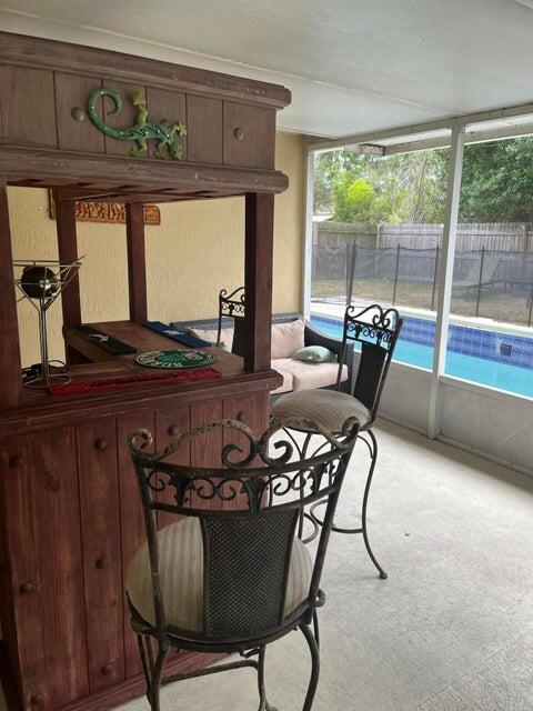 3718 SW Masilunas St, Port Saint Lucie, FL 34953 - sunroom with healthy amount of natural light