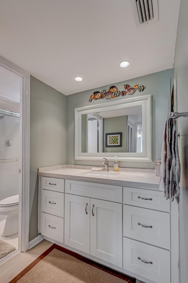 5390 Woodland Lakes Dr Unit 305, Palm Beach Gardens, FL 33418 - bathroom with vanity, a shower, and wood finished floors