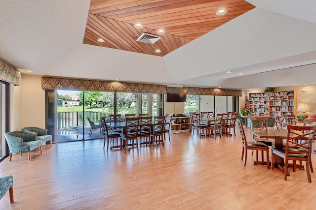 5390 Woodland Lakes Dr Unit 305, Palm Beach Gardens, FL 33418 - dining space with light wood-style floors, recessed lighting, and lofted ceiling