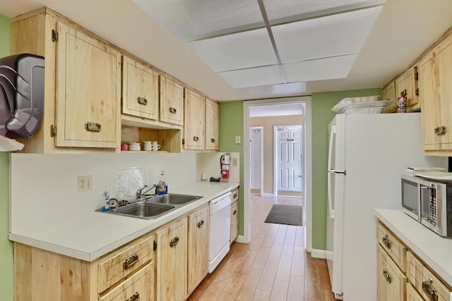 5390 Woodland Lakes Dr Unit 305, Palm Beach Gardens, FL 33418 - kitchen featuring white appliances, light brown cabinetry, light countertops, and light wood-style flooring