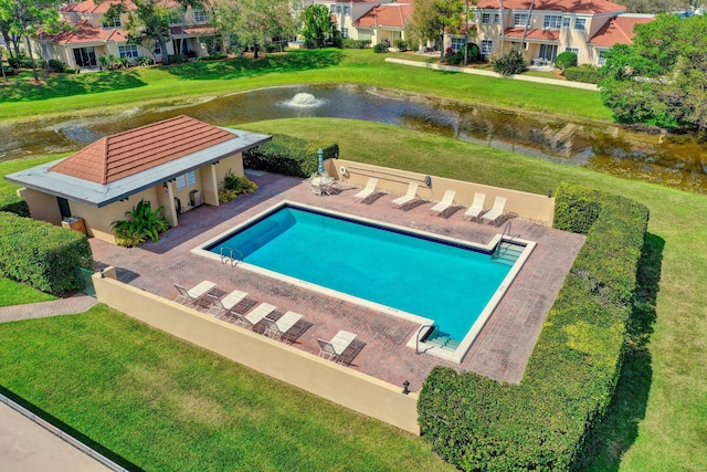 5390 Woodland Lakes Dr Unit 305, Palm Beach Gardens, FL 33418 - swimming pool featuring a water view, a patio area, and a lawn