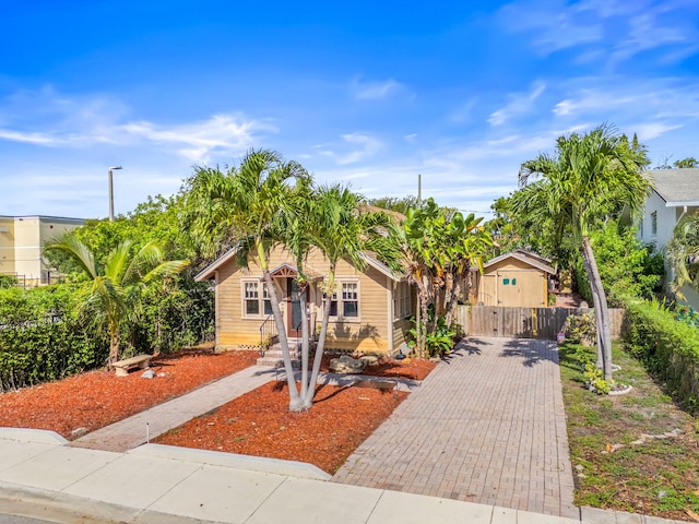 909 N L St, Lake Worth Beach, FL 33460 - view of front of home featuring decorative driveway