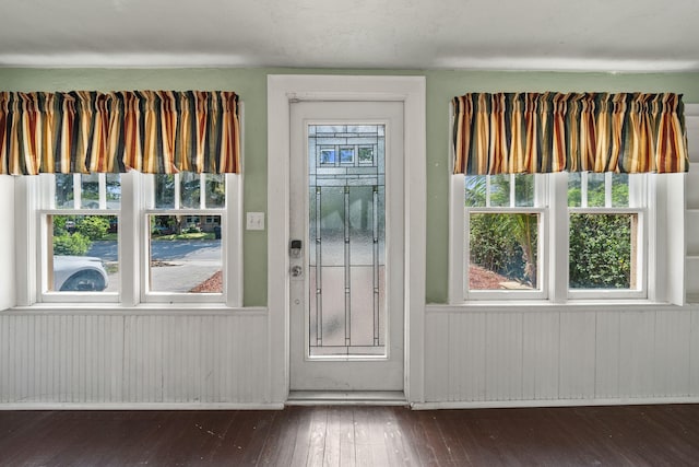 909 N L St, Lake Worth Beach, FL 33460 - entryway with hardwood / wood-style flooring and wooden walls