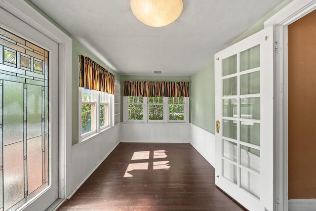 909 N L St, Lake Worth Beach, FL 33460 - unfurnished sunroom with wood-type flooring