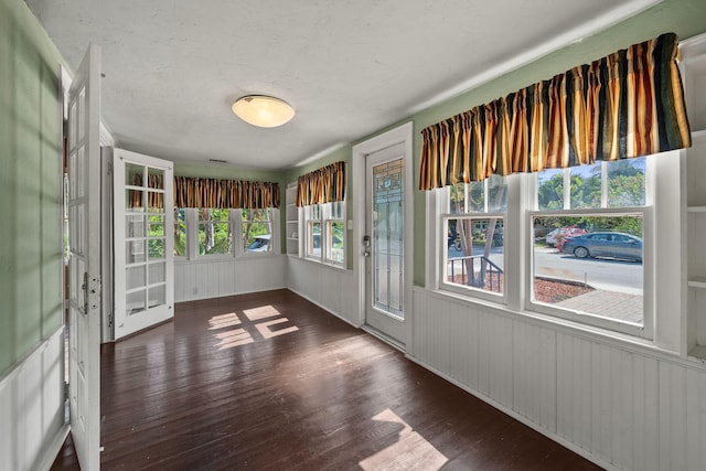 909 N L St, Lake Worth Beach, FL 33460 - unfurnished sunroom with wood finished floors and wood walls