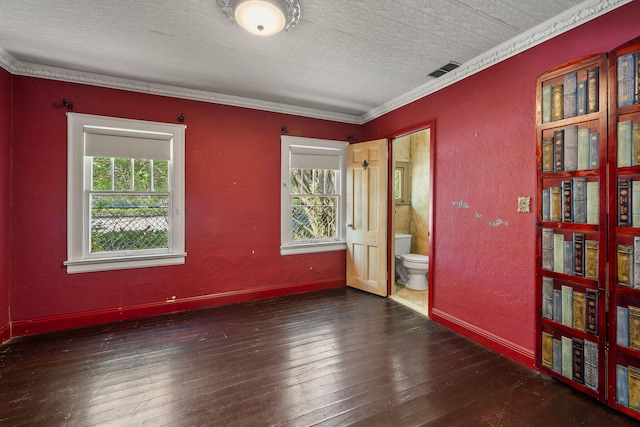 909 N L St, Lake Worth Beach, FL 33460 - empty room featuring a textured ceiling, a textured wall, wood-type flooring, and crown molding