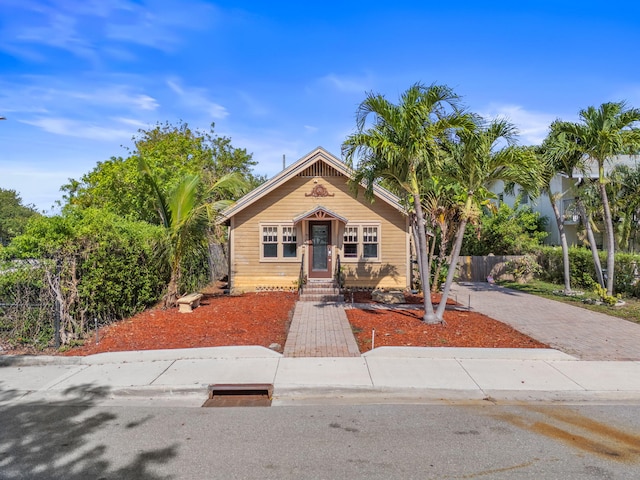 909 N L St, Lake Worth Beach, FL 33460 - view of front of home featuring decorative driveway