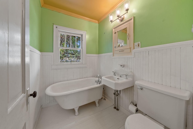 909 N L St, Lake Worth Beach, FL 33460 - full bath with a freestanding bath, a wainscoted wall, and crown molding