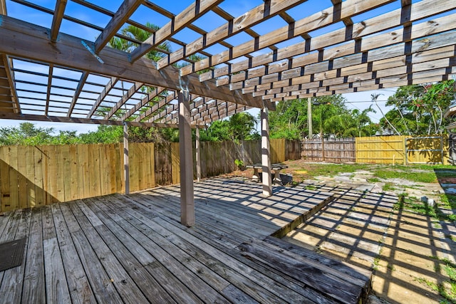 909 N L St, Lake Worth Beach, FL 33460 - wooden deck featuring a pergola and a fenced backyard