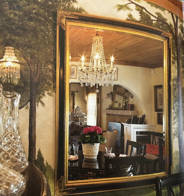 909 N L St, Lake Worth Beach, FL 33460 - dining room featuring a chandelier and a fireplace